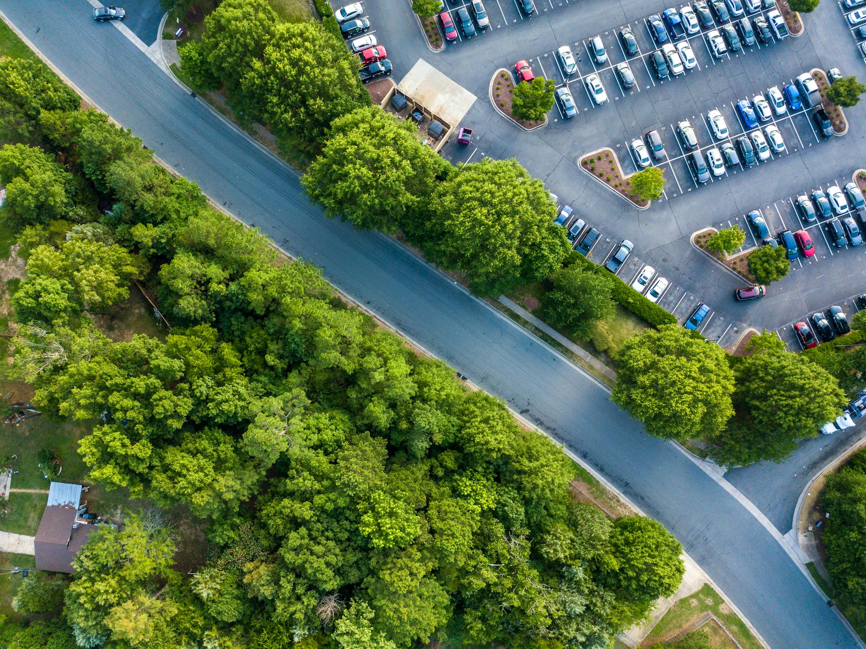 aerial footage of car park and trees